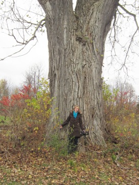 Krista in front of oldest tree in Maberly, where Morrow Hotel once stood.